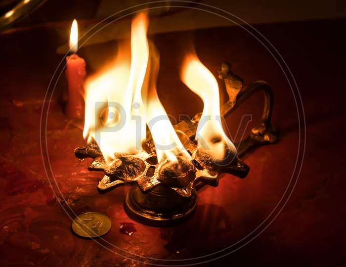 The Instruments Of Hindu Worship Are Beautiful Lamps And Indian Coins