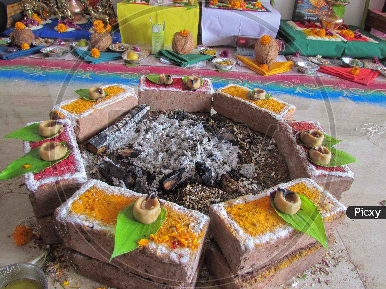 A fire place with burnt ash in the middle used for Hindu religious ceremonies
