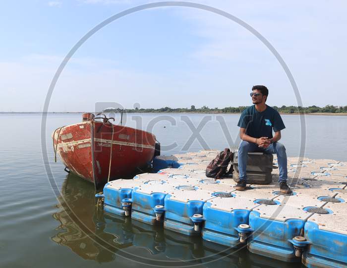 Indian Dark Boy Travelling on boat
