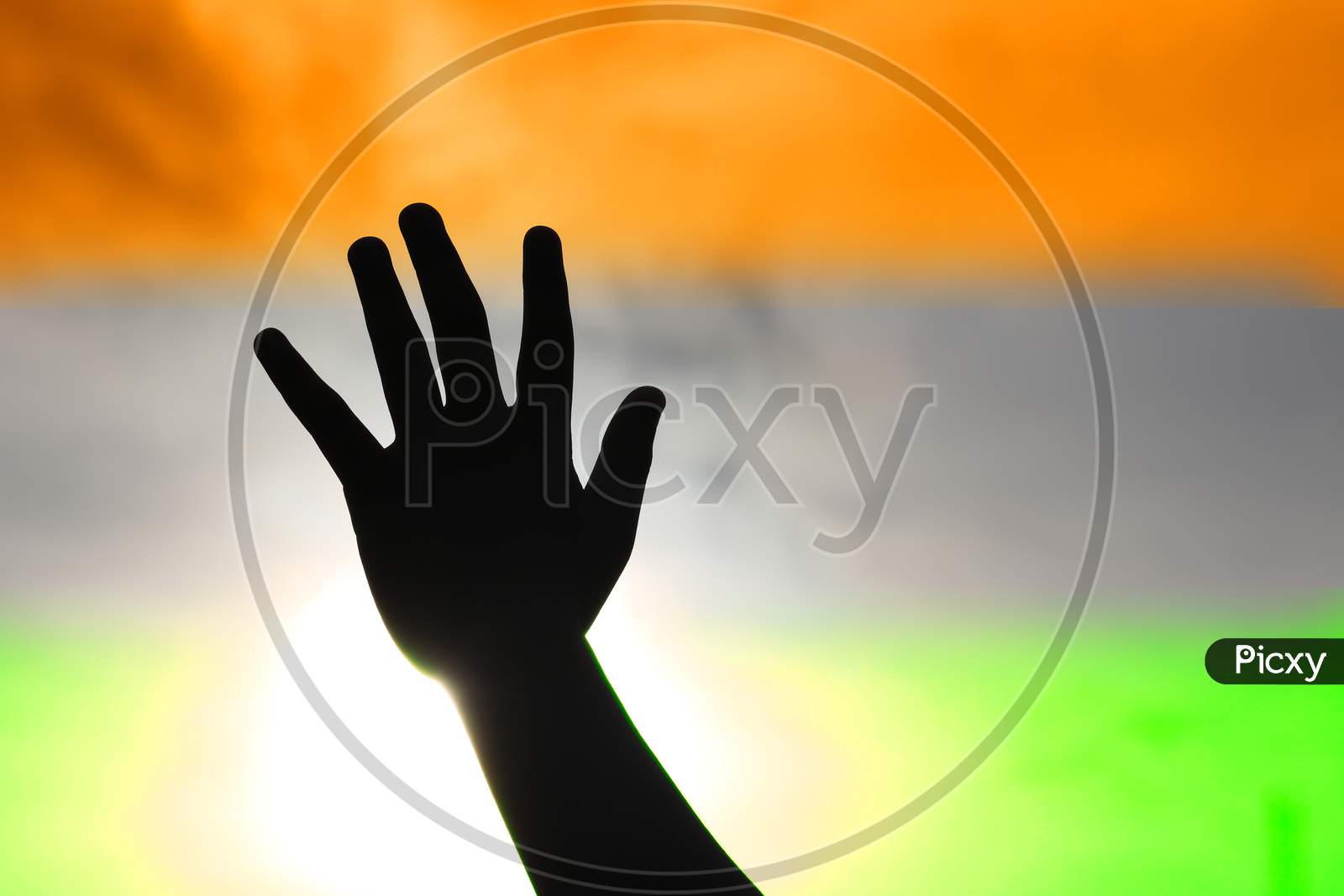 Hand reaching out to the sky celebrating the Independence of India