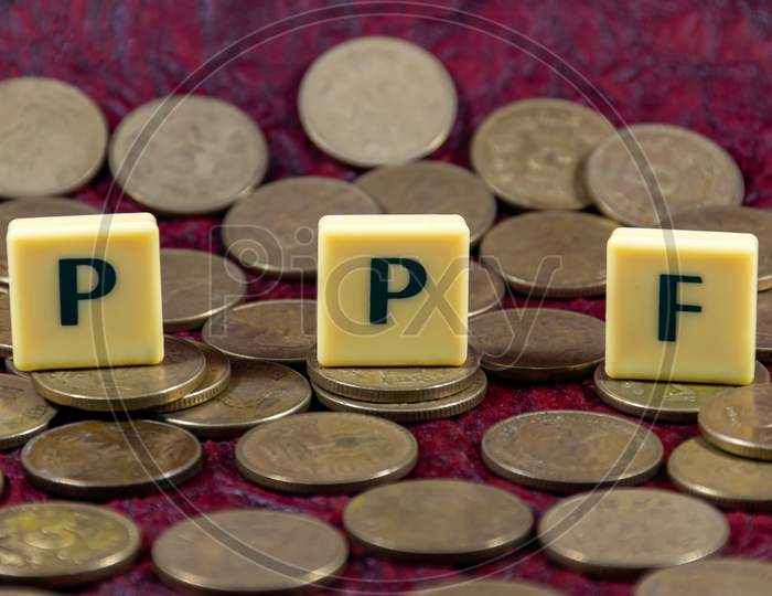 Public provident fund or PPF word design with Indian five rupee coin for various type of financial transaction or stock market option