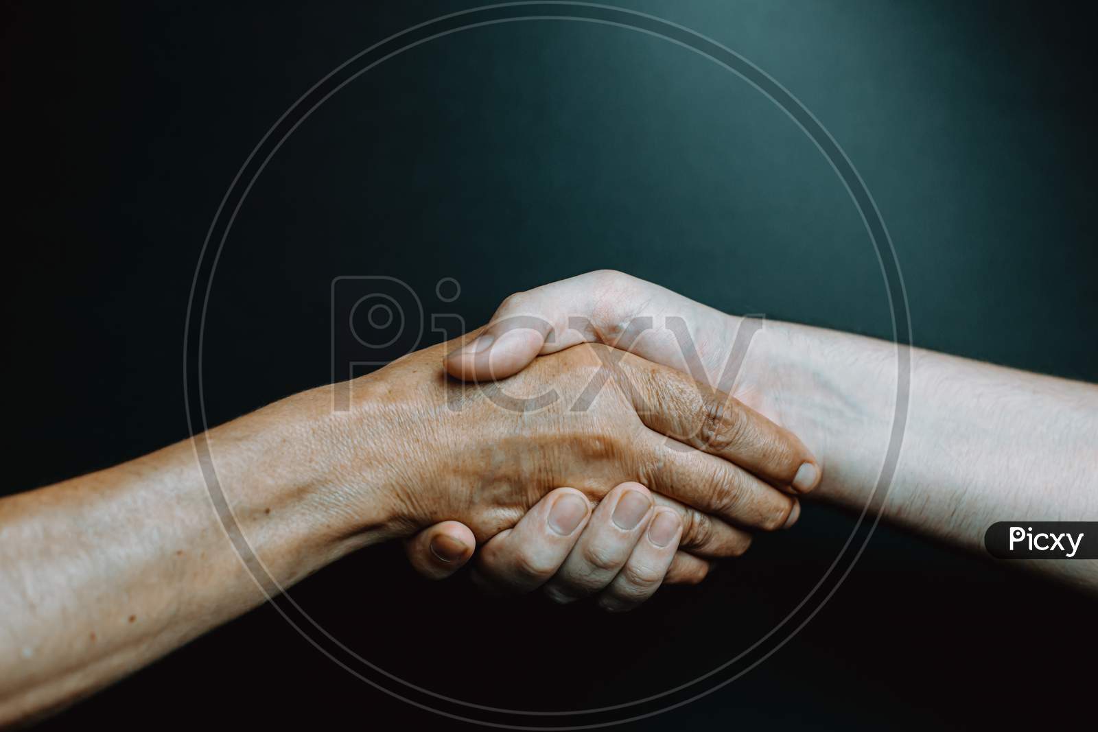 Old Latina Woman And Young Boy Hand Shaking Hands