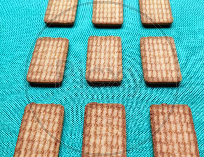 Biscuits isolated on light green texture background