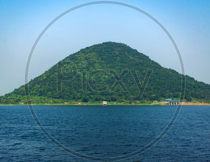 A beautiful landscape in baranti purulia westbengal India surrounded blue river like big lake with small hill top area