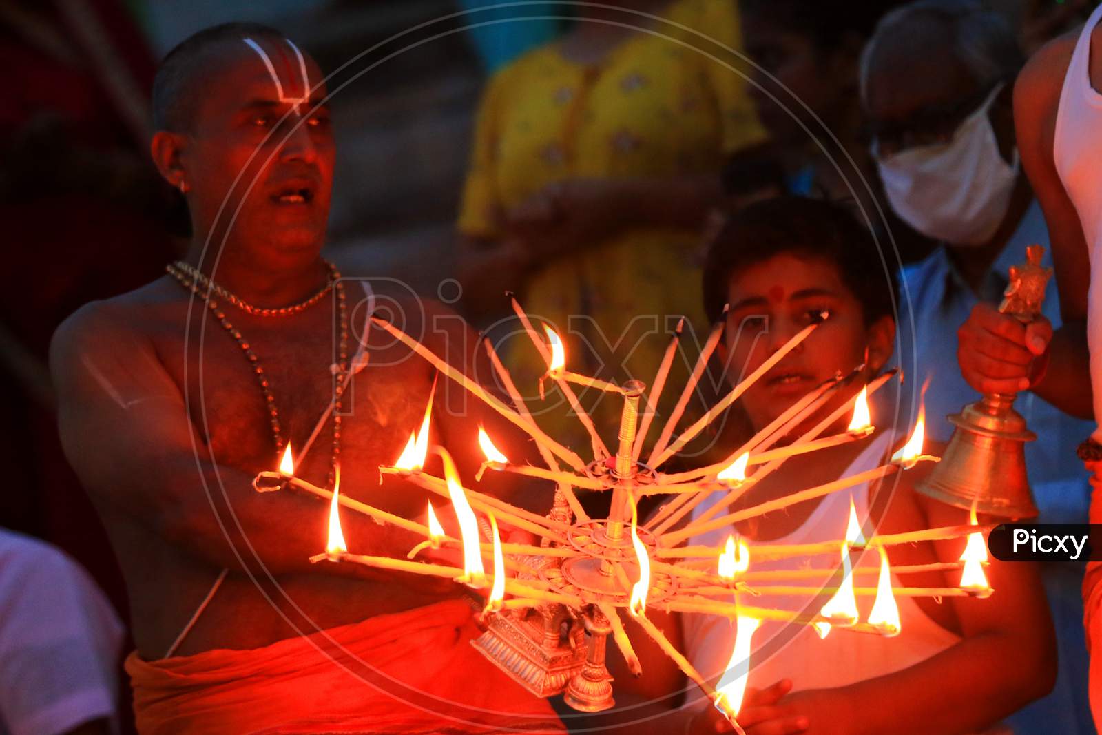 Hindu Priest performing ''Maha Aarti'' as they celebrate groundbreaking ceremony of the proposed Ram Temple, in Ayodhya, at the Holy lake In Pushkar, On August 5, 2020.