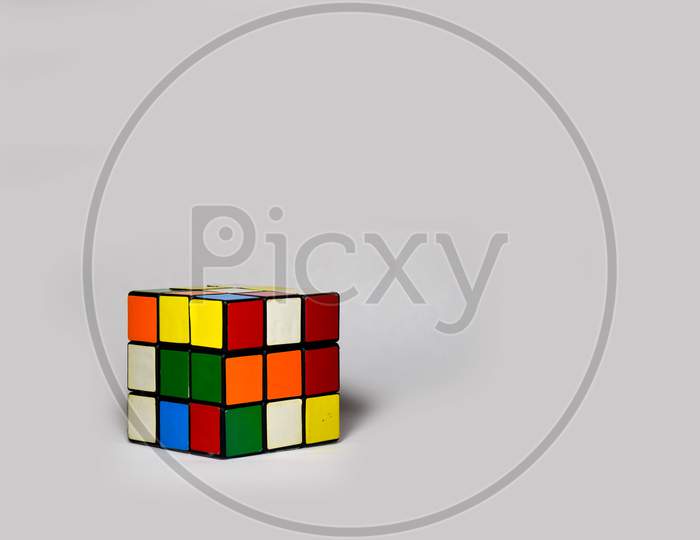 Rubik's Cube Placed Diagonally On A Plain White Background
