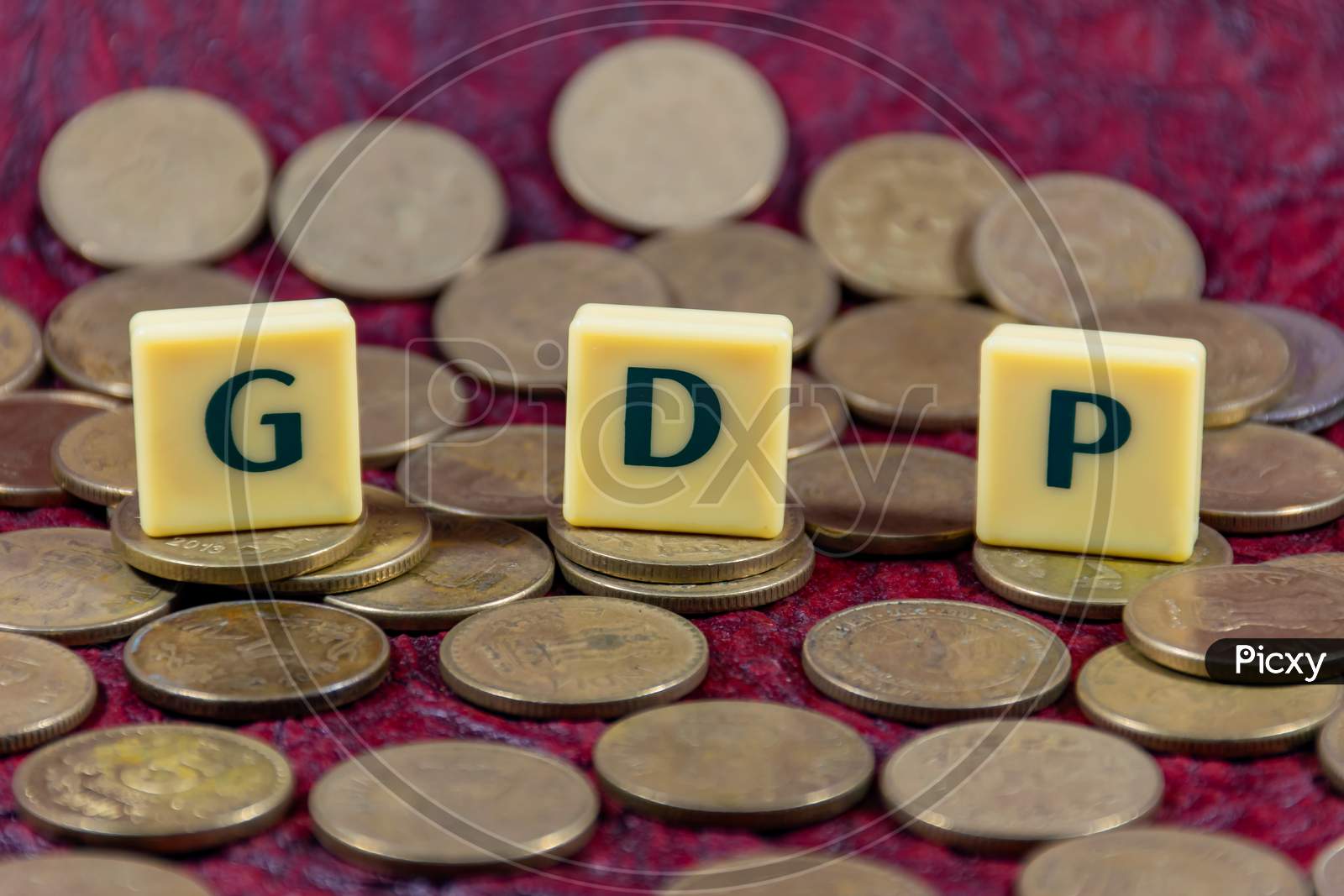 Gross domestic product or GDP word design with Indian five rupee coin for various type of financial transaction or stock market option