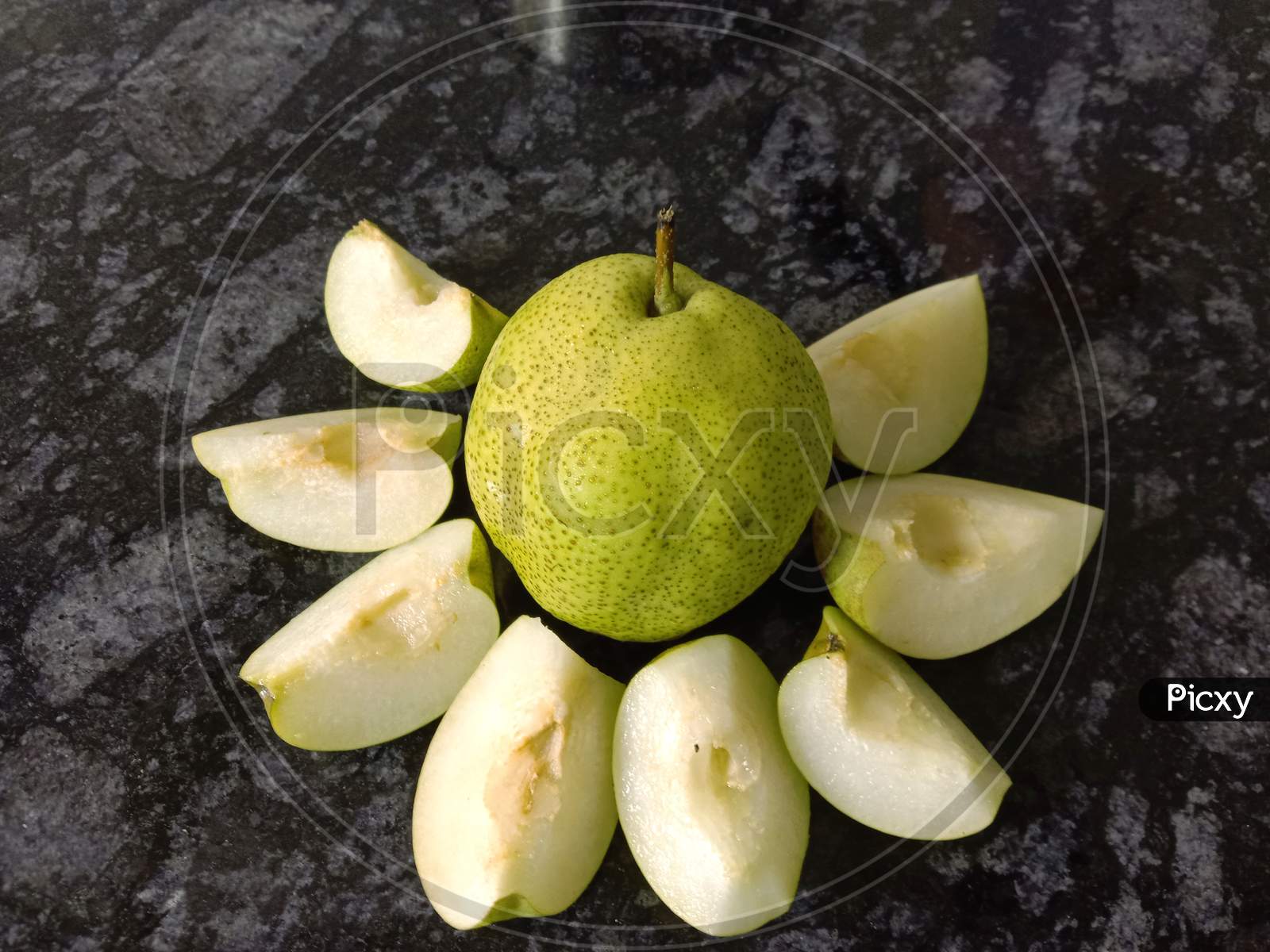 Whole Pears Slices Arranged In A Flower Shape