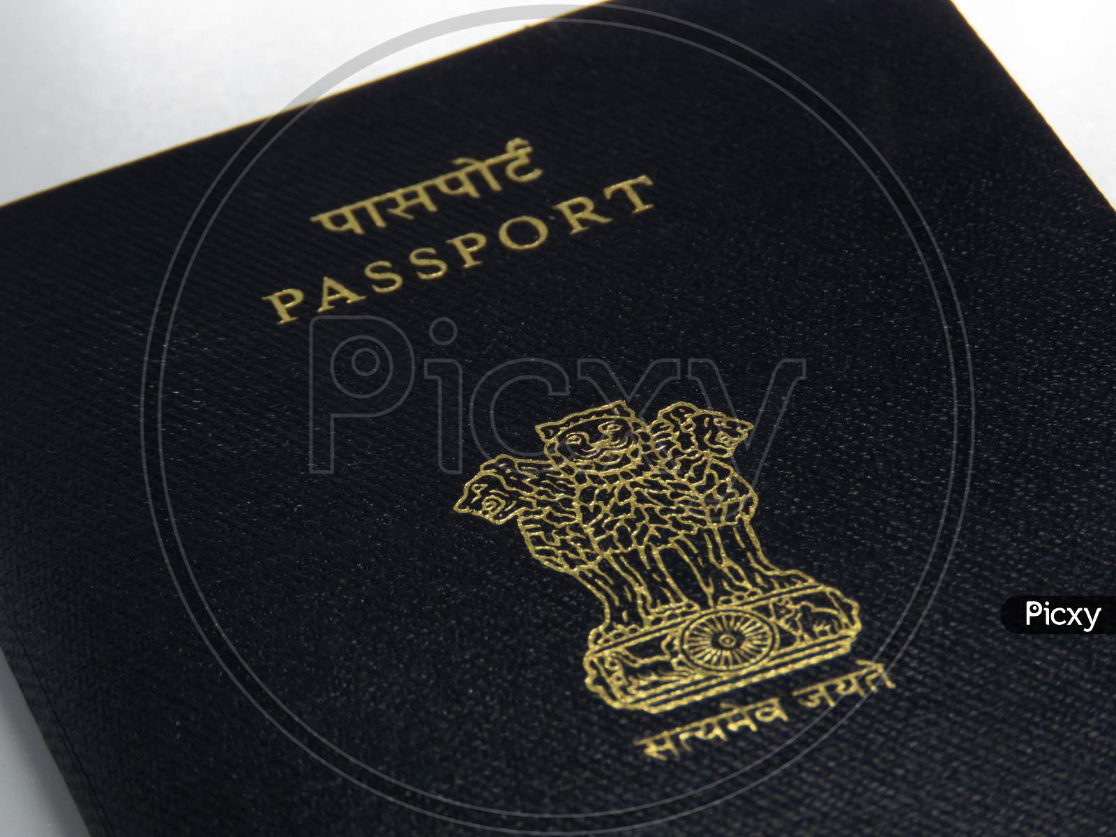 Image Of Indian Passport On White Desk.
