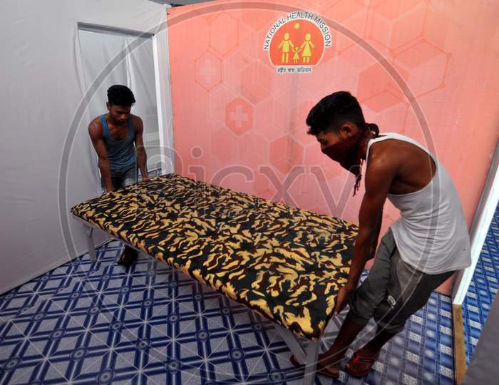 Workers Set Up A Temporary Covid-19 Care Center At Nehru Stadium In Guwahati On August 6, 2020.