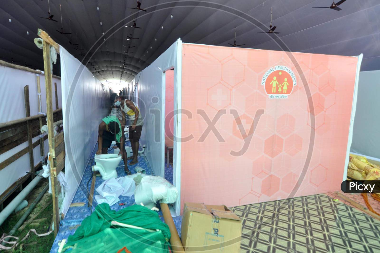 Workers Set Up A Temporary Covid-19 Care Center At Nehru Stadium In Guwahati On August 6, 2020.