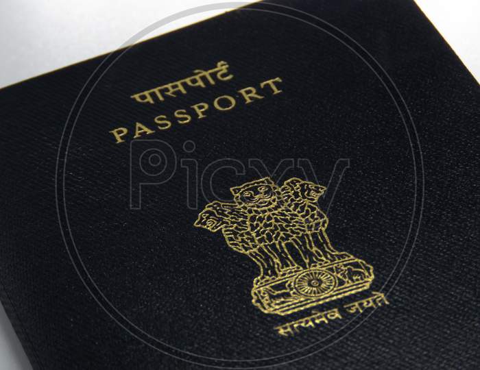 Image Of Indian Passport On White Desk.