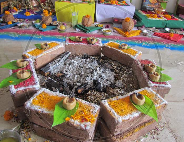 A fire place with burnt ash in the middle used for Hindu religious ceremonies