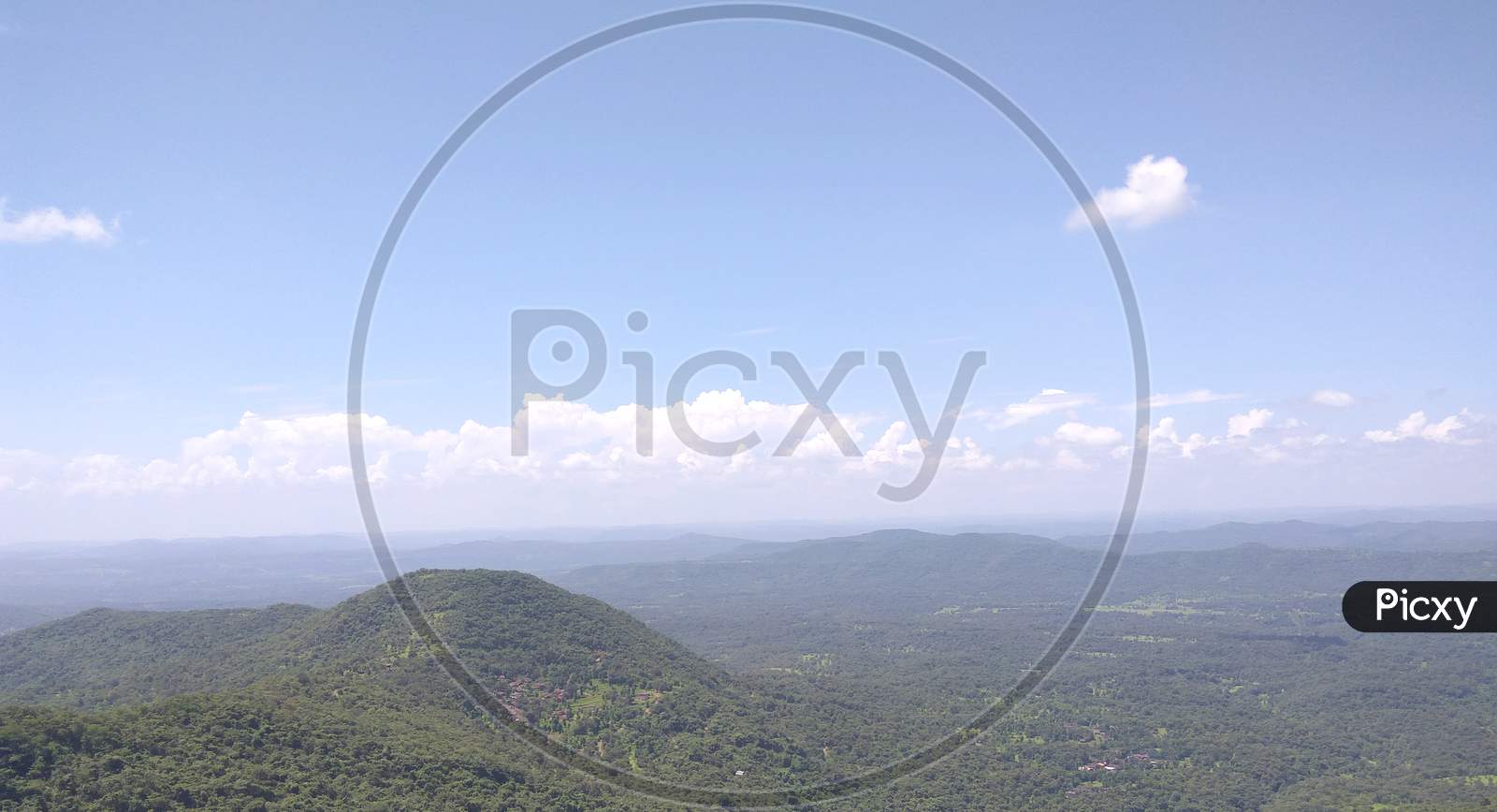The Forest And Blue Sky Background Scenery. Mountain Range Peak Clouds Landscape. Mountain Range Clouds View.