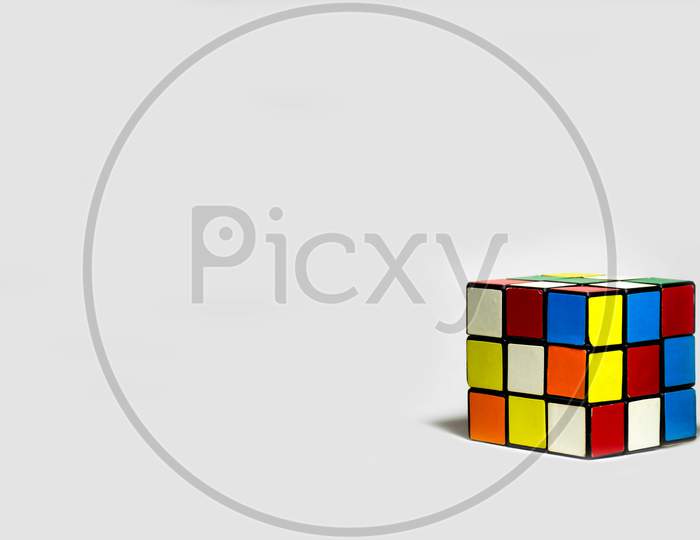 Rubik's Cube Placed Diagonally On A White Background
