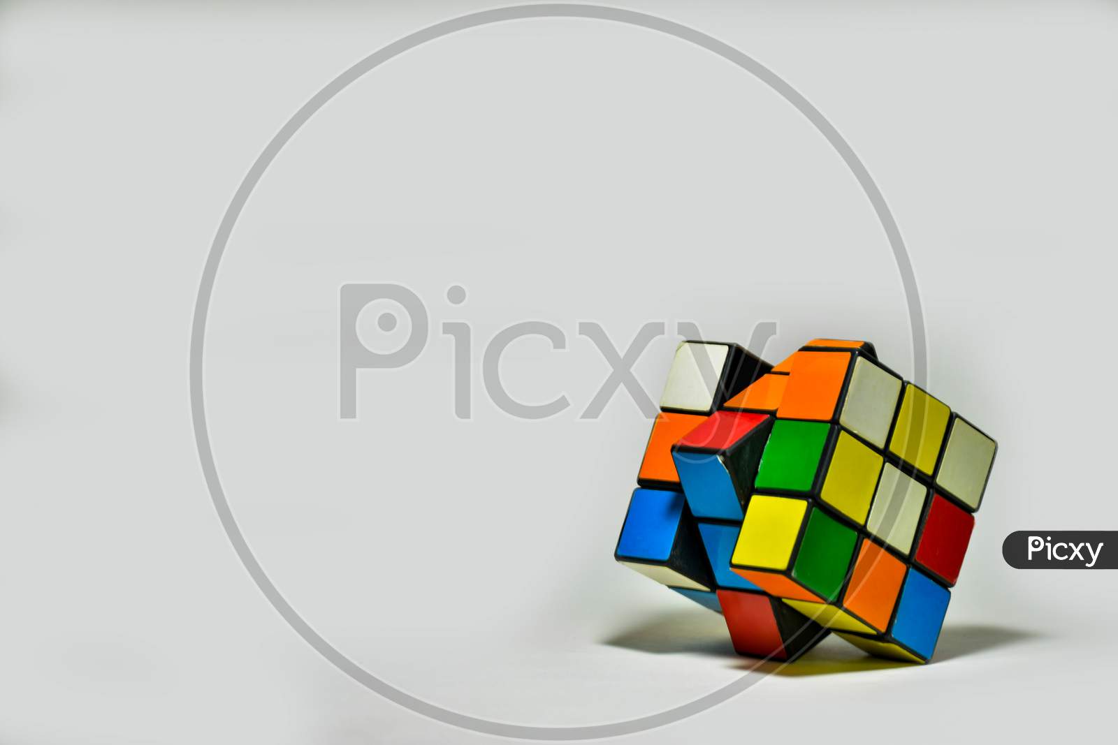 Rubik's Cube Placed Diagonally On A White Background