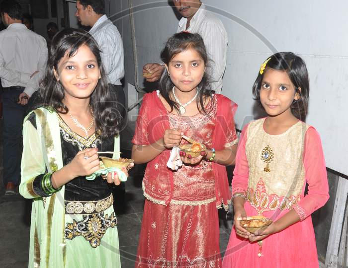 Three girls eating and enjoying aaloo chaat