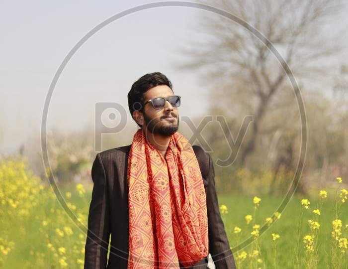 Indian Man in wedding suit in the farm