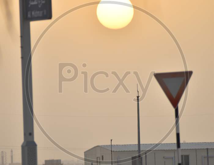 A View Of Sunset From Baniyas,Abu Dhabi.Golden Color Dramatic Sky.