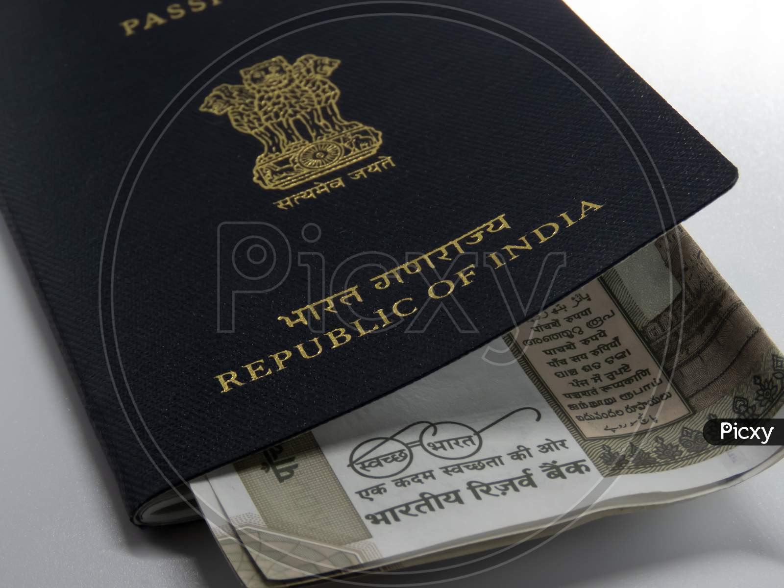 Indian Passport Kept On The Desk Along With Cash.