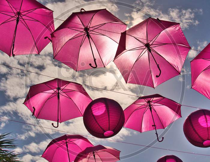 Many Pink Umbrellas Floating Recognizing Cancer Awareness Month