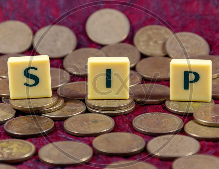 Systematic Investment Plan or SIP word design with Indian five rupee coin for various type of financial transaction or stock market option