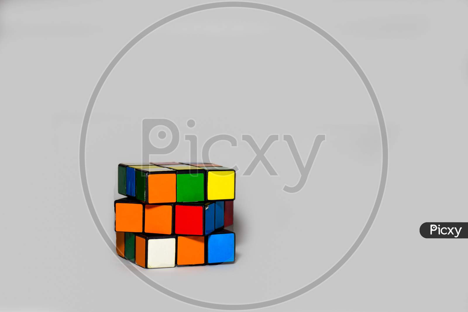 Rubik's Cube Placed Diagonally On A Plain White Background