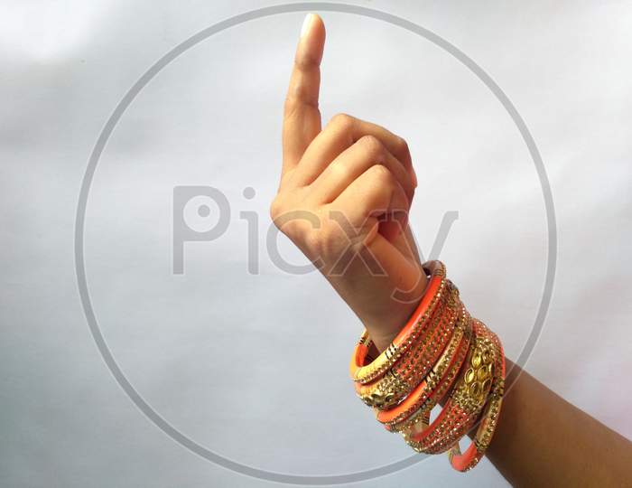 Stack of gold bangle with vivid color and rhinestone isolated on white background