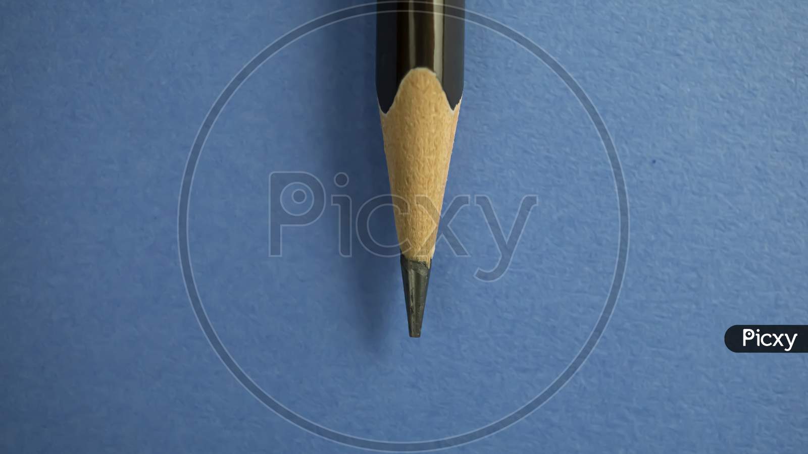 pencil closeup on blue textured background