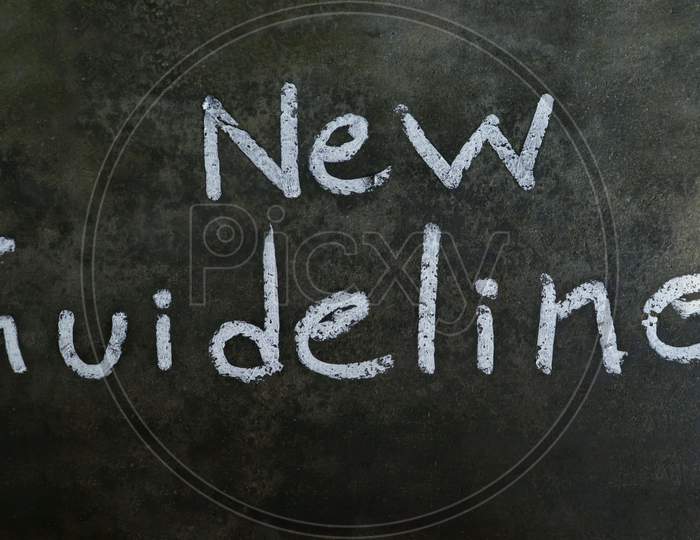 New Guidelines Phrase Written On Blackboard With White Chalk