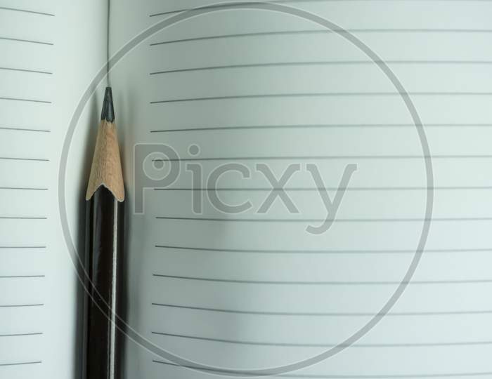 Pencil closeup with notebook paper
