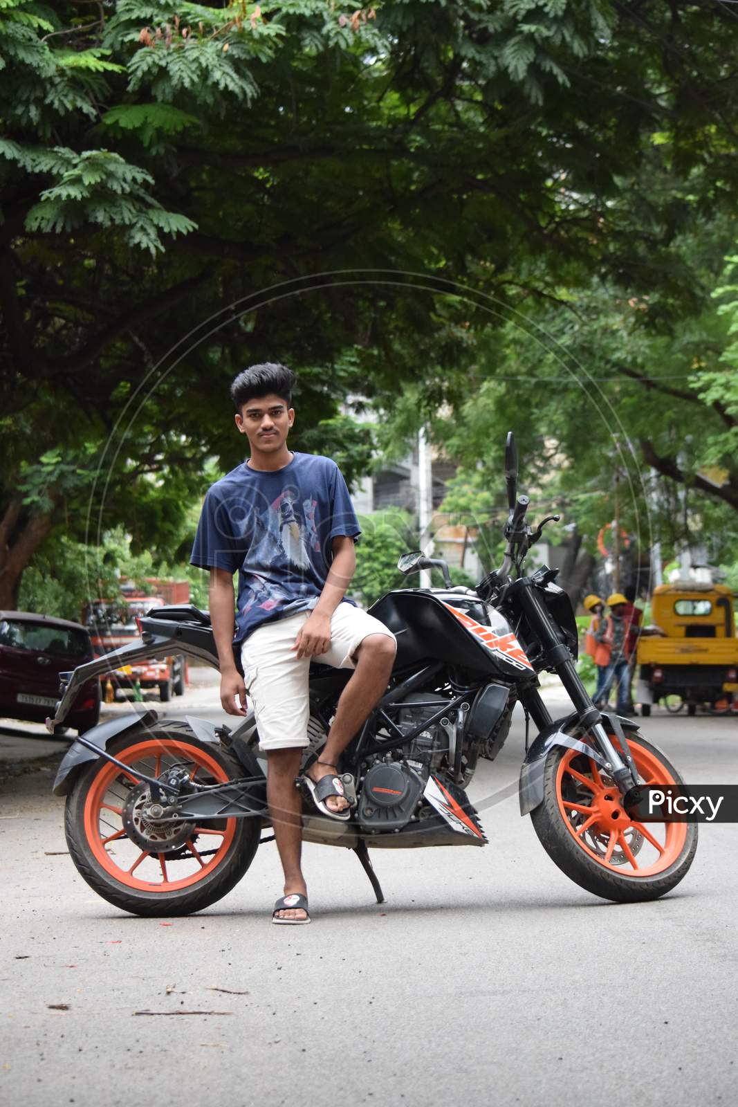 Hyderabad, Telangana, India. August-07-2020: Portrait Of Young Man At Outdoor, Young Man Posing On Bike