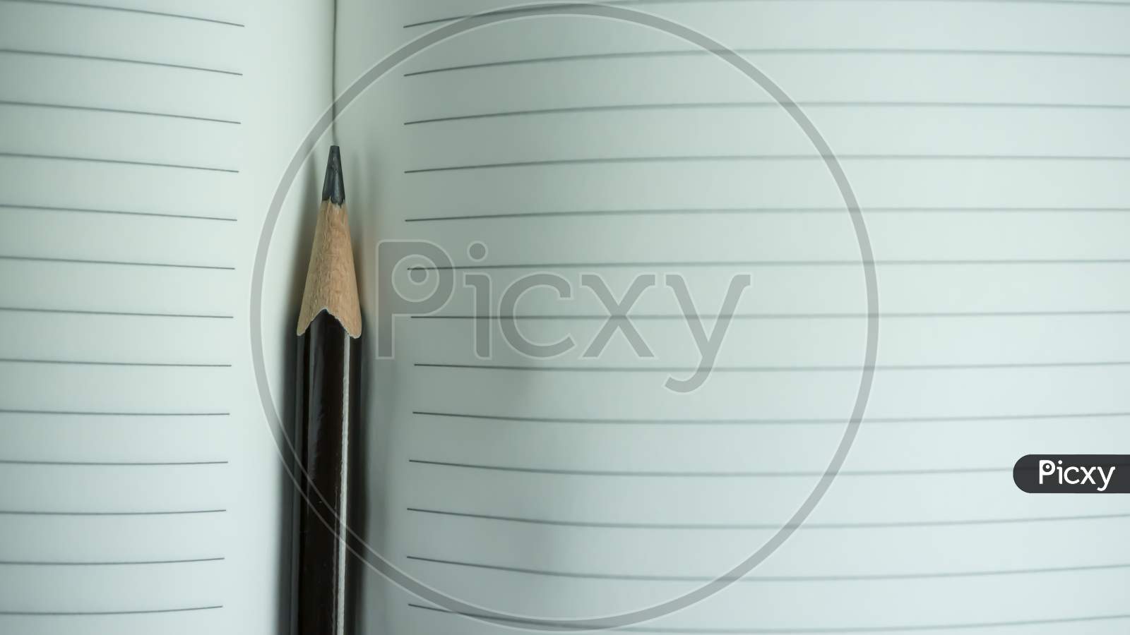 Pencil closeup with notebook paper