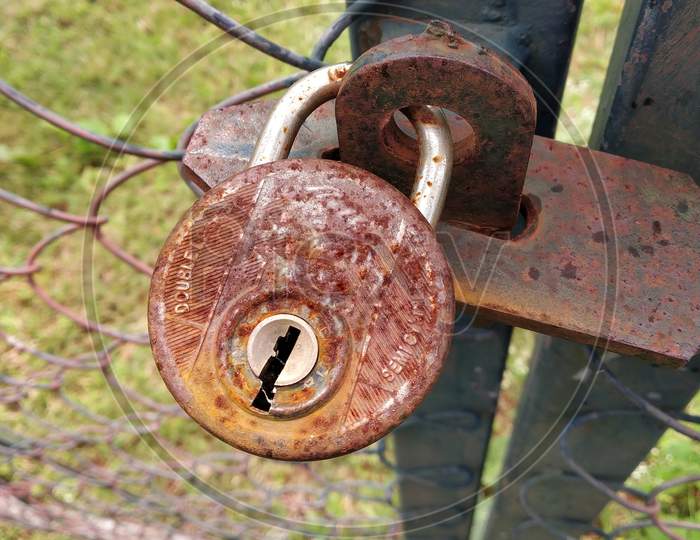 Rusted lock on the gate
