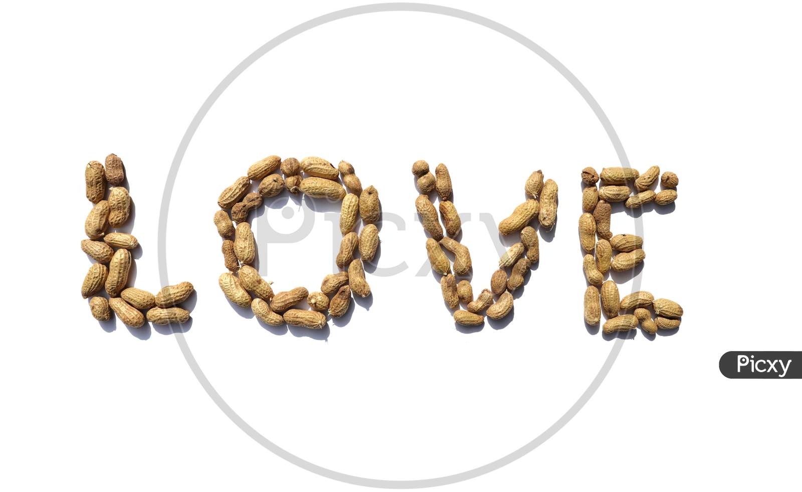 Love Word Written With Peanuts On White Background In Horizontal Orientation, Perfect For Wallpaper