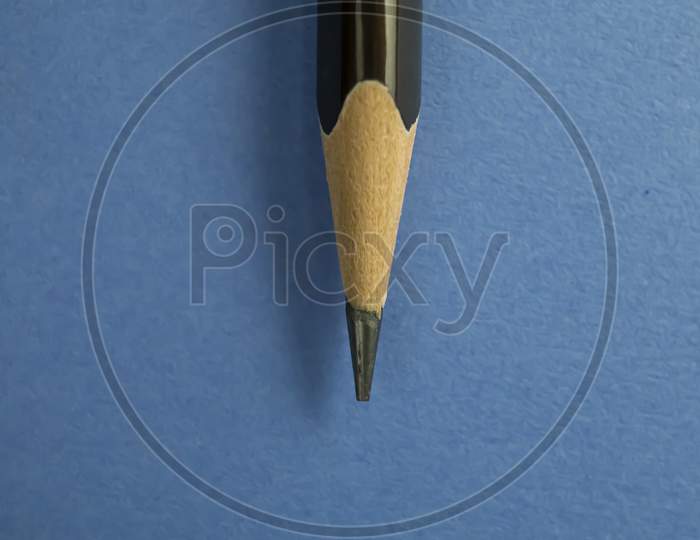 pencil closeup on blue textured background