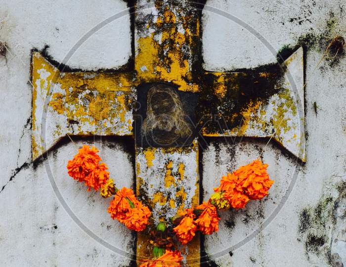 Catholic Cross On Wall With Jesus And Garland