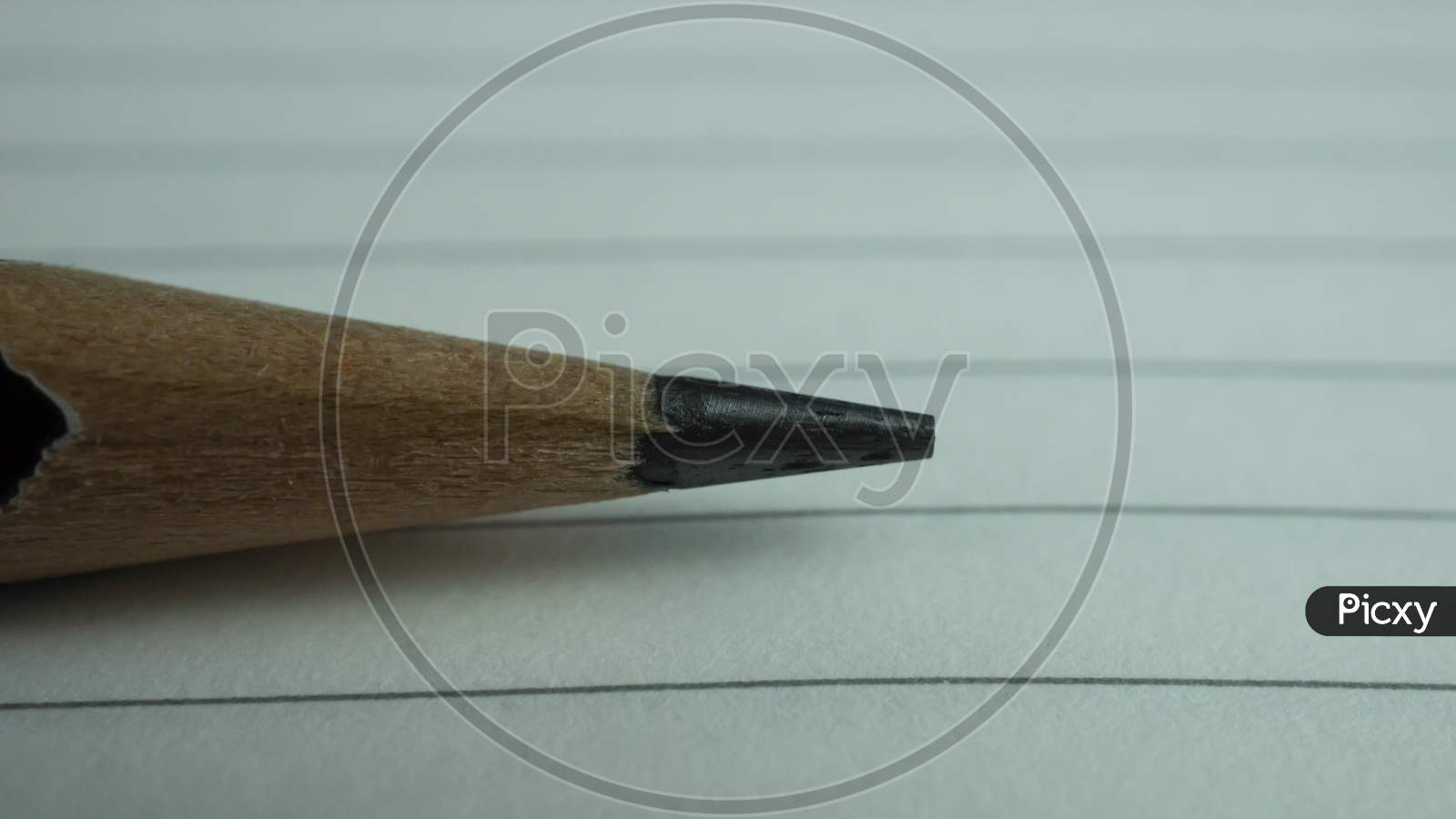 Macro shot of pencil with notebook paper