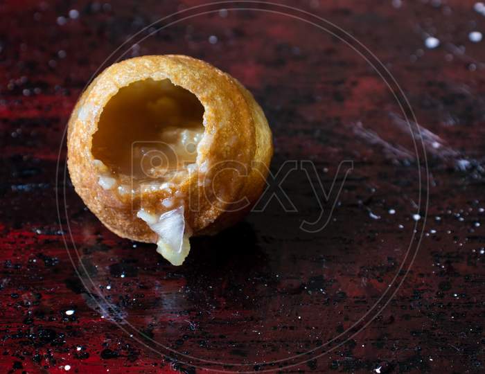 Panipuri Or Golgappa Isolated On Reddish Background With Copy Space For Texts Writing, Also Known As Phuchka, Paani Patashi, Gol Gappa, Gup Chup