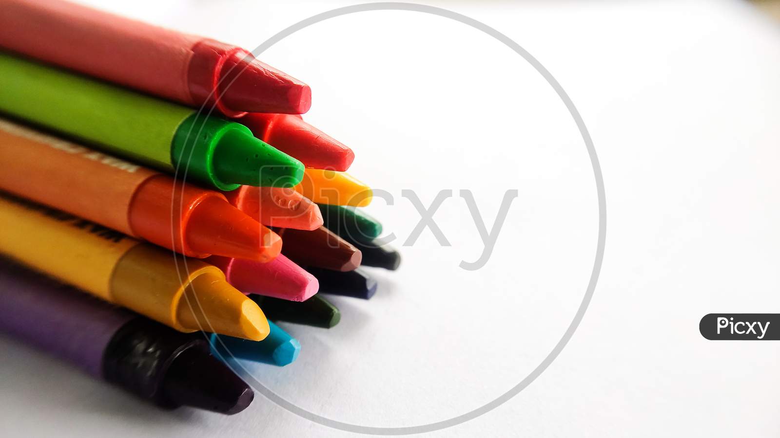 Crayons arranged in a pyramid shape