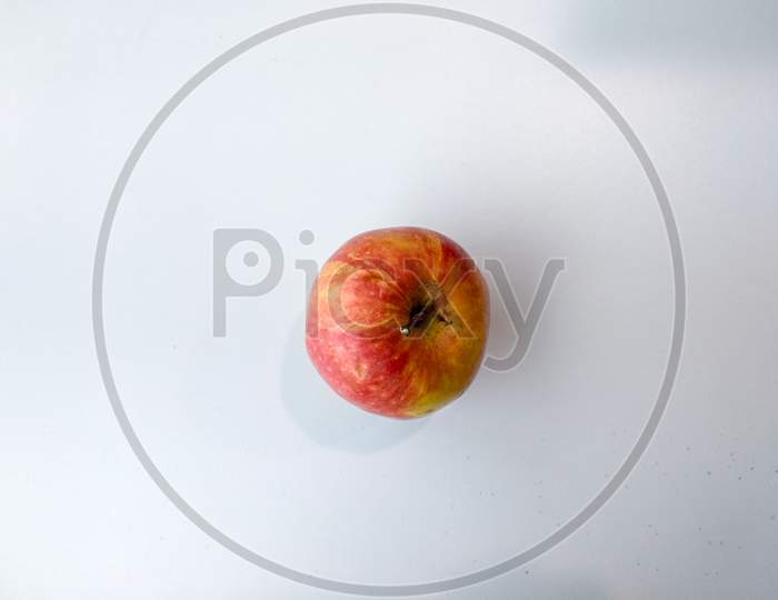 Apple On A White Background From Above With Space For Text