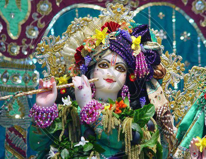 Lord Krishna statue having flute in hands