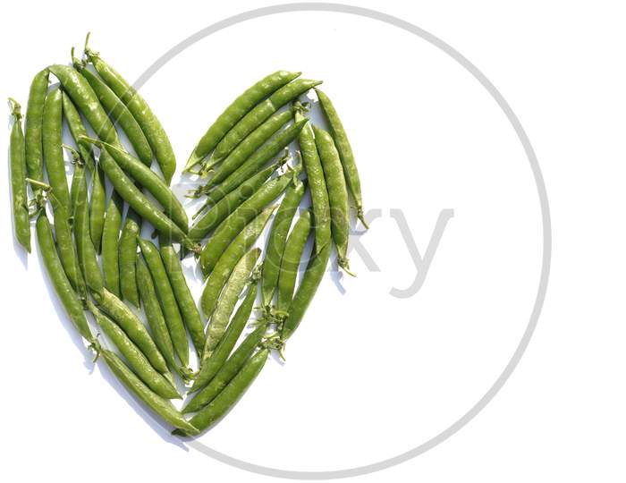 Heart Shape Created With Green Pea Isolated On White Background With Copy Space
