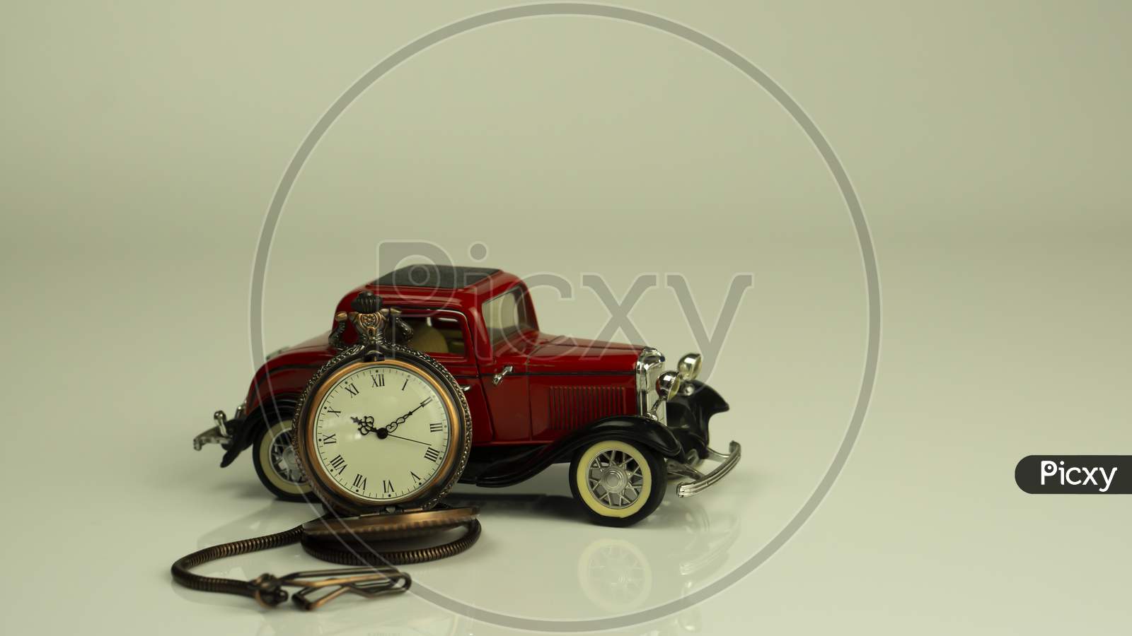 A time clock with red vintage concept card model with nice reflection on white background