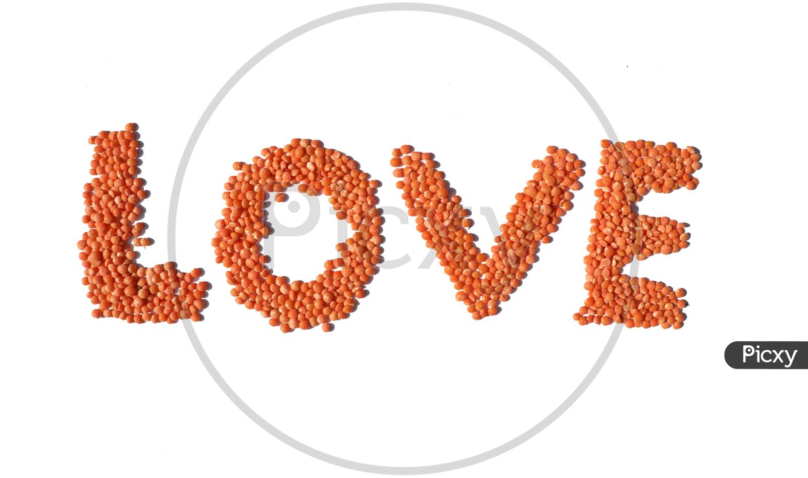 Love Word Written With Red Lentils On White Background With Copy Space, Perfect For Wallpaper