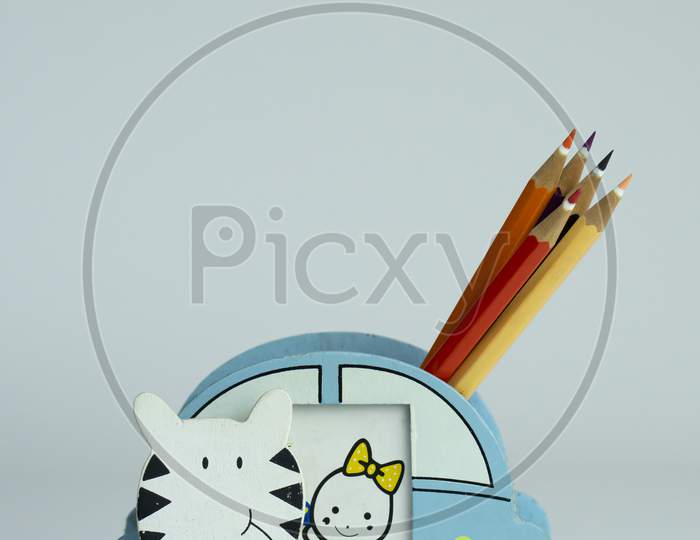 A nice pencil stand for kids kept on a isolated vertical background