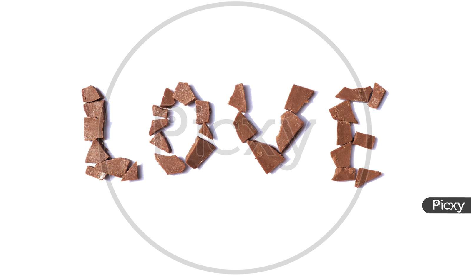 Love Word Written With Chocolate Pieces On White Background, Perfect For Wallpaper