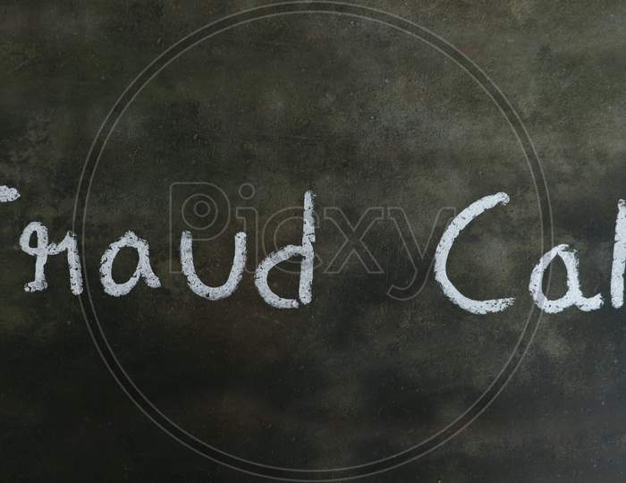 Fraud Call Phrase Written On Blackboard With White Chalk