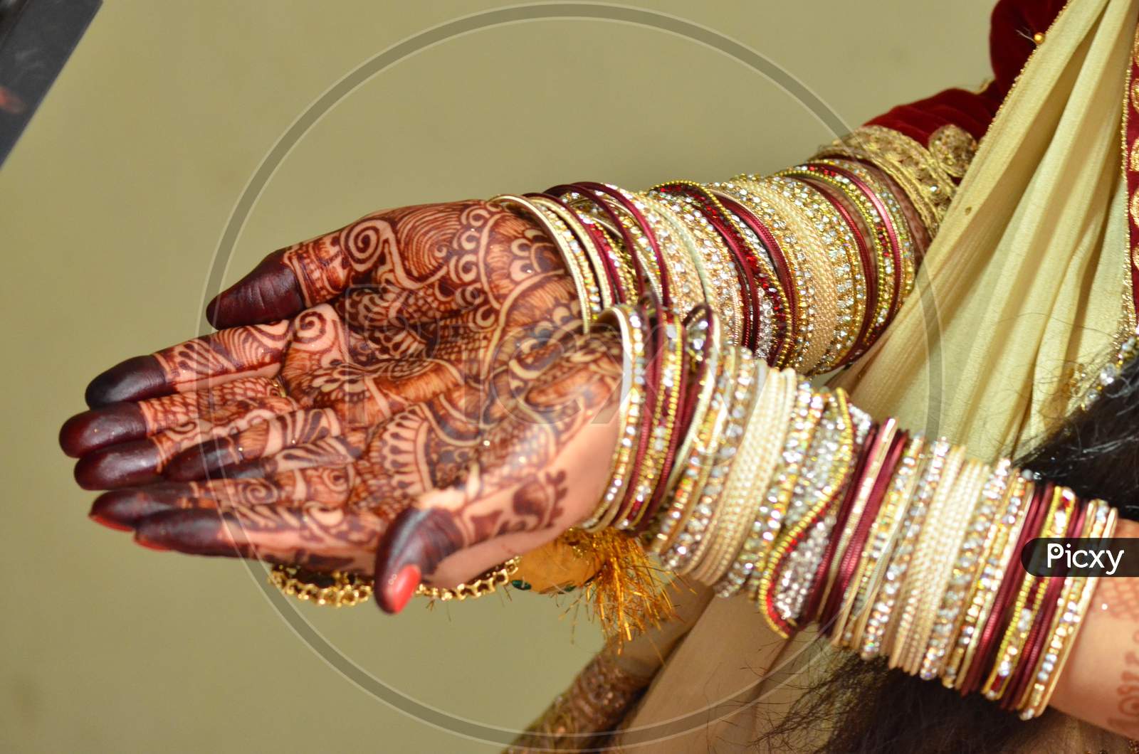 Indian Bride showing Mehndi hands