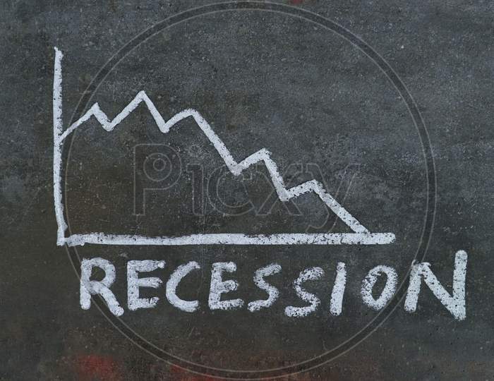 Recession Word Written On Black Surface With White Chalk, Economy Crisis Conceptual Photo